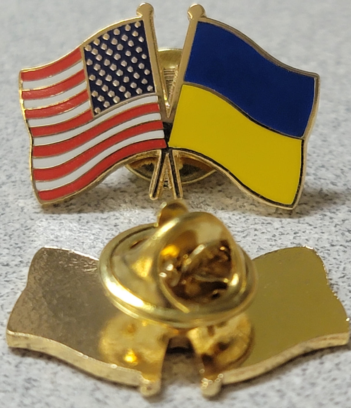 usa and ukraine crossed flags metal pin, showing front and back. red white and blue flag with blue and yellow flag.