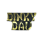 gold and black dinky dau metal pin